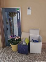 Entire lot with print, faux flowers, boxes containing orb