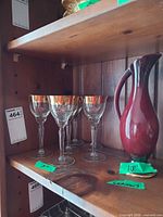 Set on shelf showing pitcher and four glasses