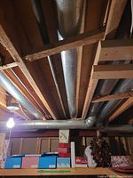 Shelf view with boxed train set, blue mountain box, red marbled boxes, holly box, pine cone wreath