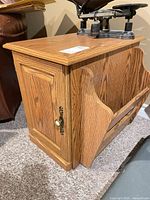 Front and side view showing cabinet door, magazine rack, hardware and finish