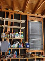 Wide view of both shelves showing full assortment of chemical containers