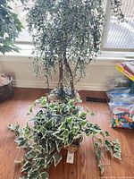 Both artificial plants shown together for scale and form