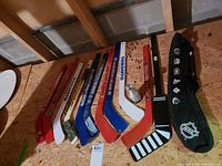 All nine mini sticks, trophy and carry bag laid flat