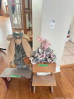 Overall view of desk, bench and two dolls