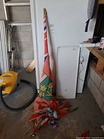 Ontario flag on long pole crumpled on floor