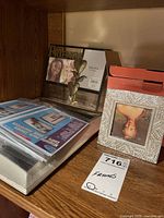 Shelf view showing sealed clip frames, FRIENDS frame, square rhinestone frame and memory box