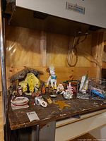 Overall view of lot showing stable, nativity figures, star topper, ornaments, unicorn