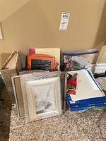 Group view: sheet protectors pack, copy paper ream, binder dividers, zipper pouch, scissors, picture frames, file holder