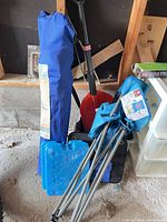 Chair in carry bag, cooler folded, two ice packs visible