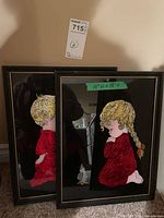 both framed artworks standing side by side