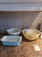 Full set on countertop showing all five Pyrex pieces