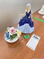 Figurine and posy bowl together on tabletop