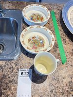 Two Bunnykins bowls side by side showing size and interior scenes