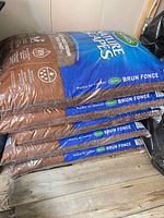 Stack of four Scotts Nature Scapes Deep Forest Brown Mulch bags