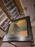 Top view showing printed ship scene, faux leather border, corner protectors