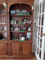 Front view of solid wood hutch showing shelves and lower cabinets