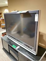 Front three-quarter view of Sony rear-projection TV on stand