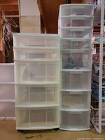 Two plastic drawer towers side by side showing drawer count and color