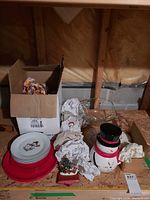 Group view of plates, cup, cookie jar, glass bowl, red tray