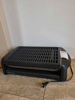 Front-angle view showing overall appliance and power cord