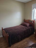Full view of assembled twin bed with comforter and pillow