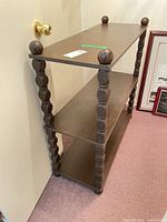 Full view of three-tier étagère shelf showing overall design and condition