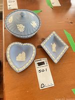All three Wedgwood blue jasperware pieces displayed together on table