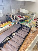 Overview showing Wolfgang Puck knife roll, utensil bins, foil/wrap boxes