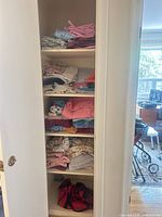 Full linen closet with six shelves of assorted folded linens