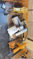 All three corded Black & Decker power tools grouped on bench