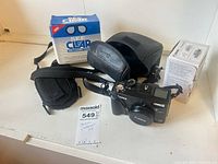 Canon PowerShot G2 camera with accessories and boxes