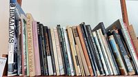 Full shelf of approximately 25 art and photography books