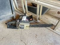 Left side view of Mastercraft MC 2500 chainsaw on garage floor