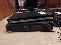 Samsung DVD-R150 stacked on Sony SLV-585HF with power cords