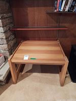 Front view of square pine side table