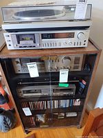 Front view showing glass doors and shelves