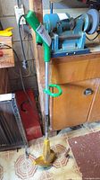 Full view of Yardworks string trimmer standing upright
