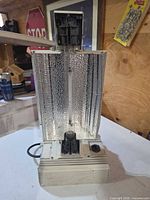 Front view of ballast and reflector showing installed lamp