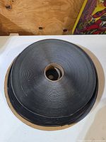 Top view of first large roll of black Velcro tape