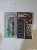 Both tool sets side by side: sealed Guardian Pro set and unbranded green-handle set