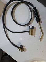 Full view of torch handle, hose and angled nozzle