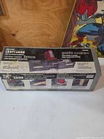 Closed box showing Craftsman router table fence set graphics
