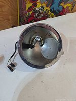 Inside view of headlight bucket showing wiring and interior