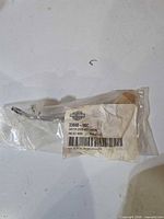 Bagged Harley-Davidson shifter lever assembly with label visible