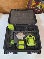 case open showing laser level, accessories in foam