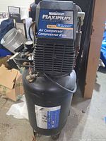 Full view of Mastercraft Maximum vertical 15-gallon air compressor showing tank, motor housing, handle and wheels