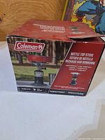 Front of Coleman bottle top stove retail box
