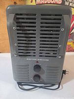 Front view showing louvers, control panel and power cord