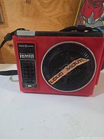 Front view of red General Electric Loud Mouth 8-track player showing speaker grille and branding