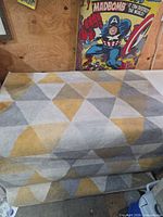 Full view of folded rug showing geometric pattern